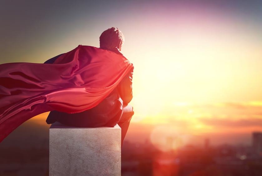 superhero businessman looking at city