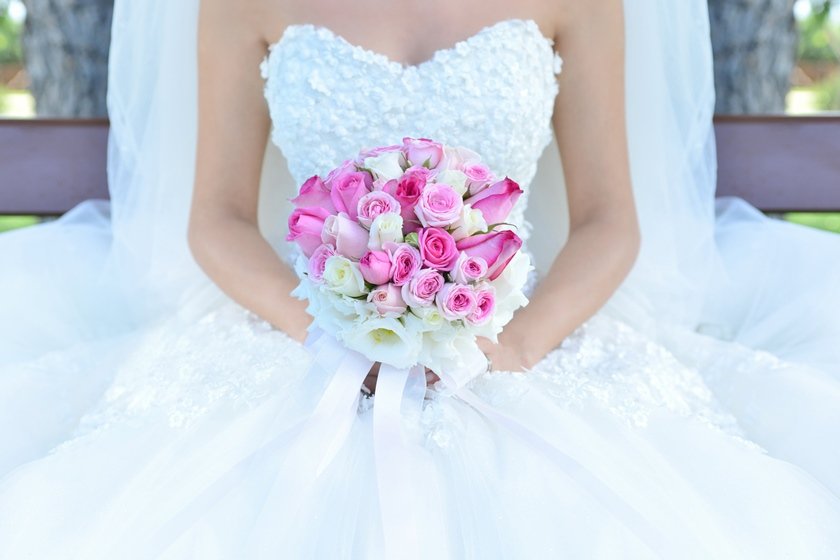 Bride holding flower bouquet. Stock Image