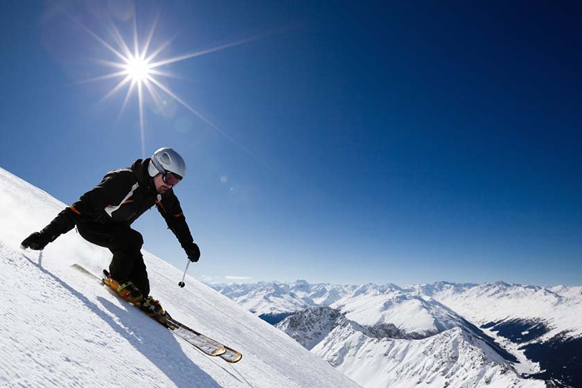 Male skier with mountain view