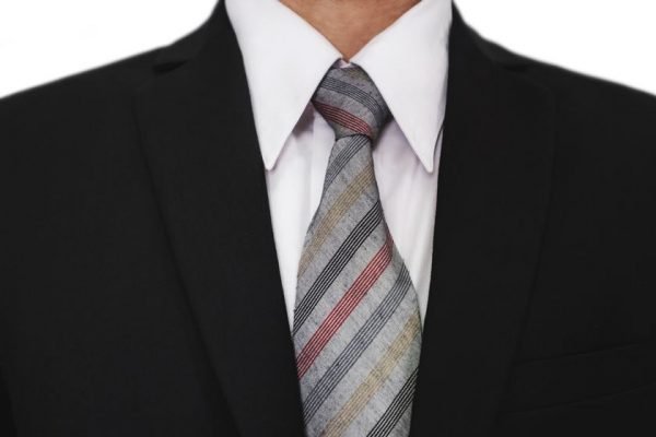 Close-up of businessman wearing black suit with a gray tie