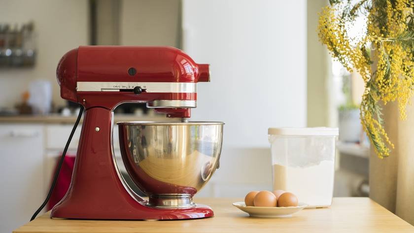 Cooking with red stand mixer on light kitchen