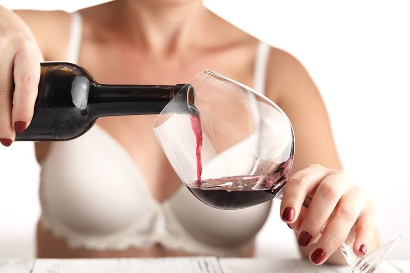 Woman testing benefit of natural red wine