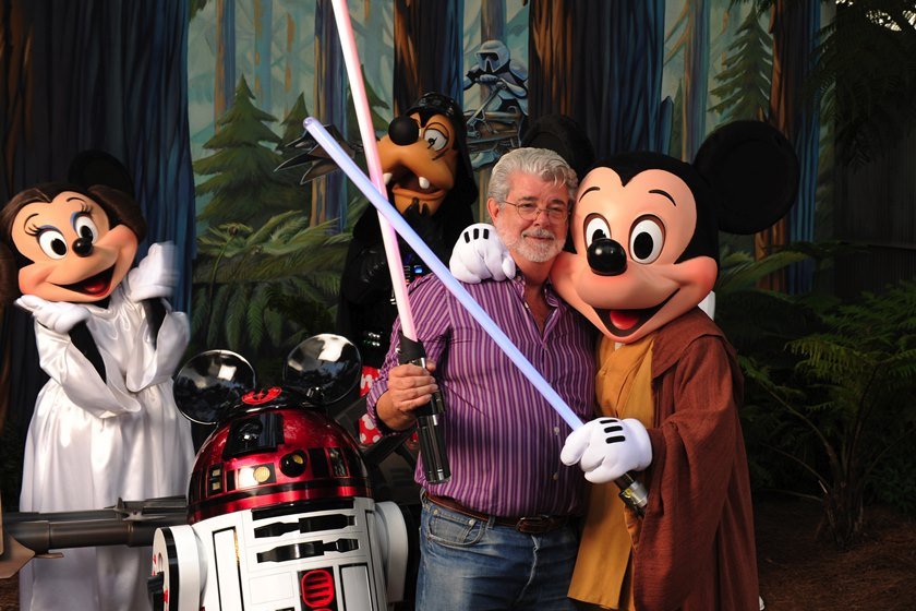 George Lucas Poses With A Group Of "Star Wars" Inspired Disney Characters At Disney