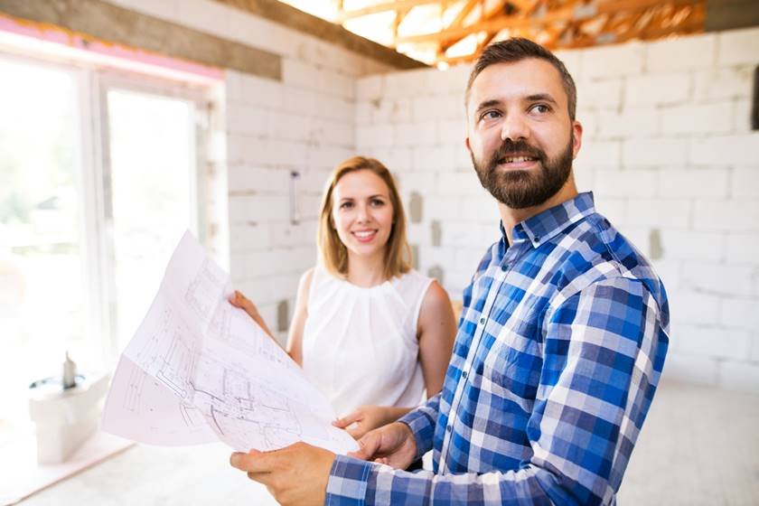 Young couple at the construction site.