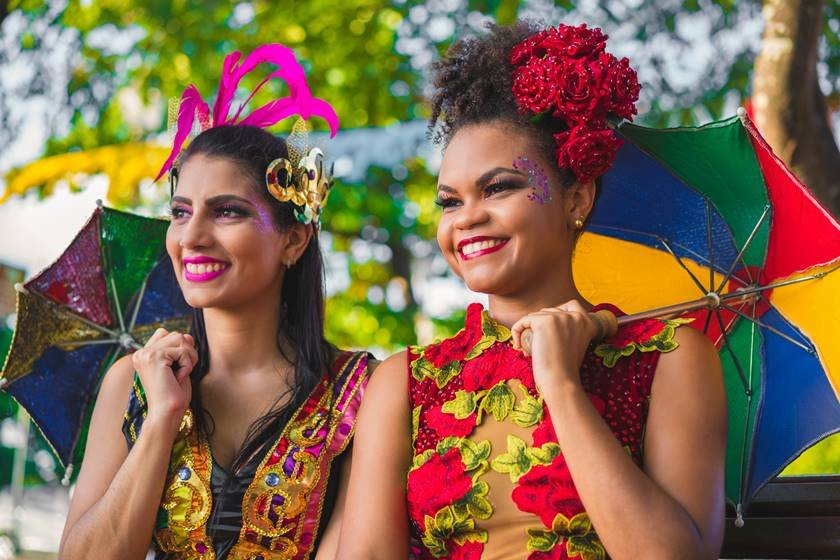 Close-Up Of Smiling Young Women In Costumes During Carnival