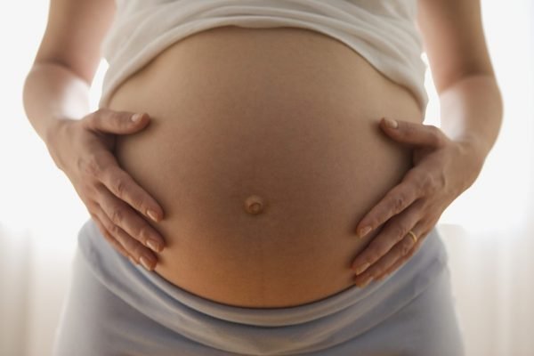 Close up of pregnant woman’s belly