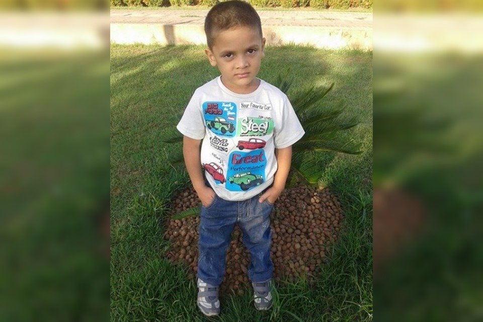 Boy standing with hands in pocket