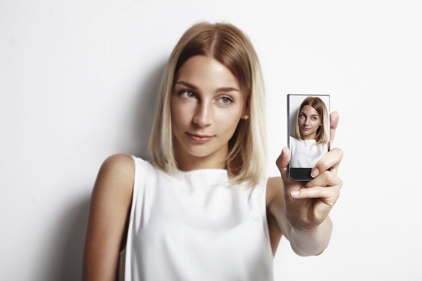 Woman making selfie with mobile phone