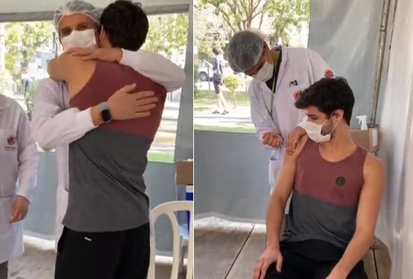 Pai aplica vacina em filho em Curitiba