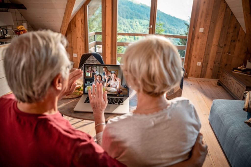 Colored photograph of Seniors and computer