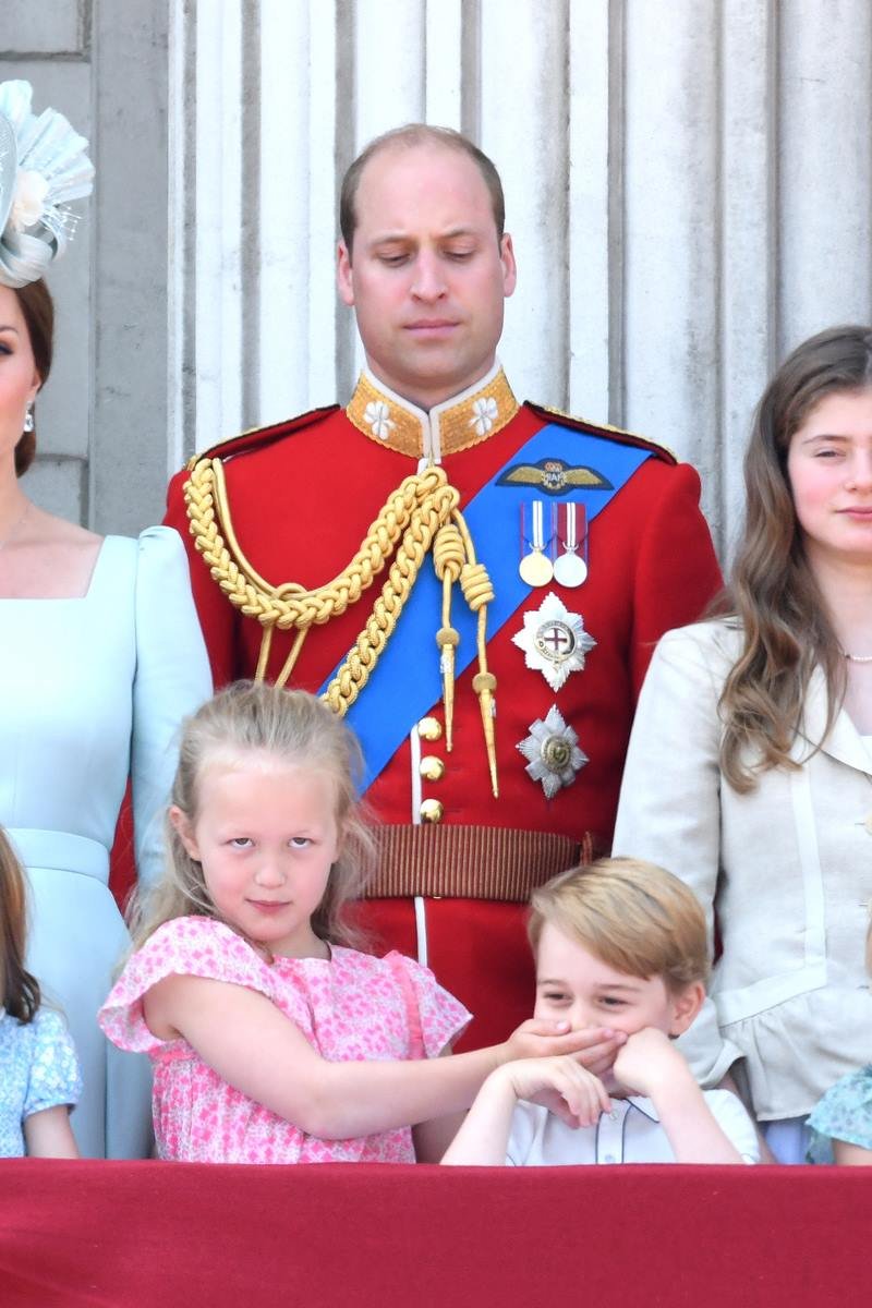 Prince William, Duke of Cambridge, Savannah Phillips and Prince George of Cambridge on the balcony of Buckingham Palace