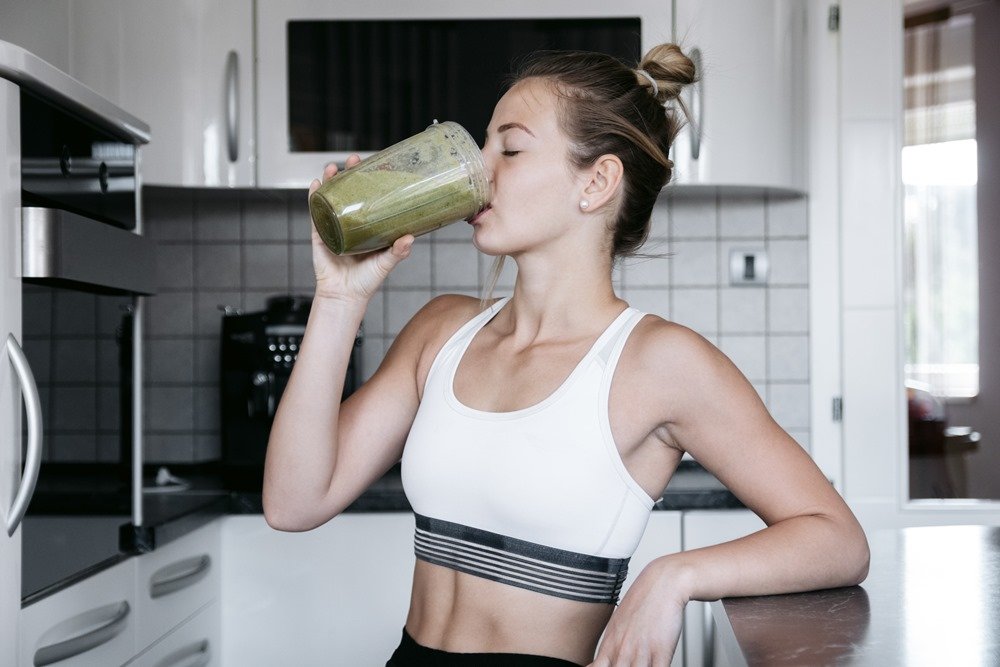 Woman drinks detox juice