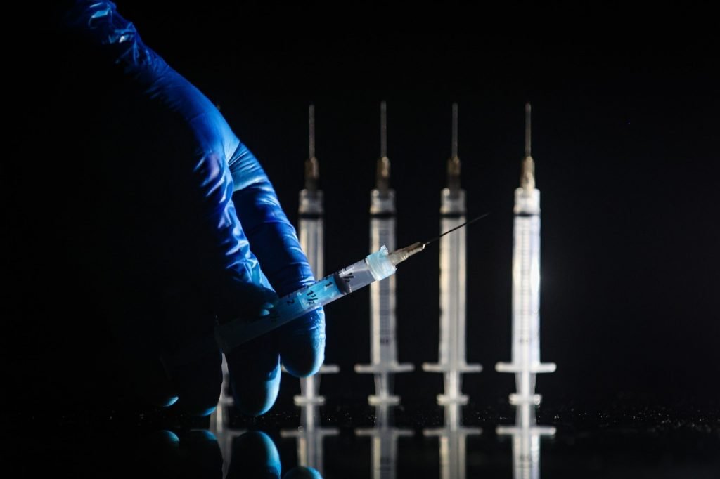 Colored photograph of vaccine syringes