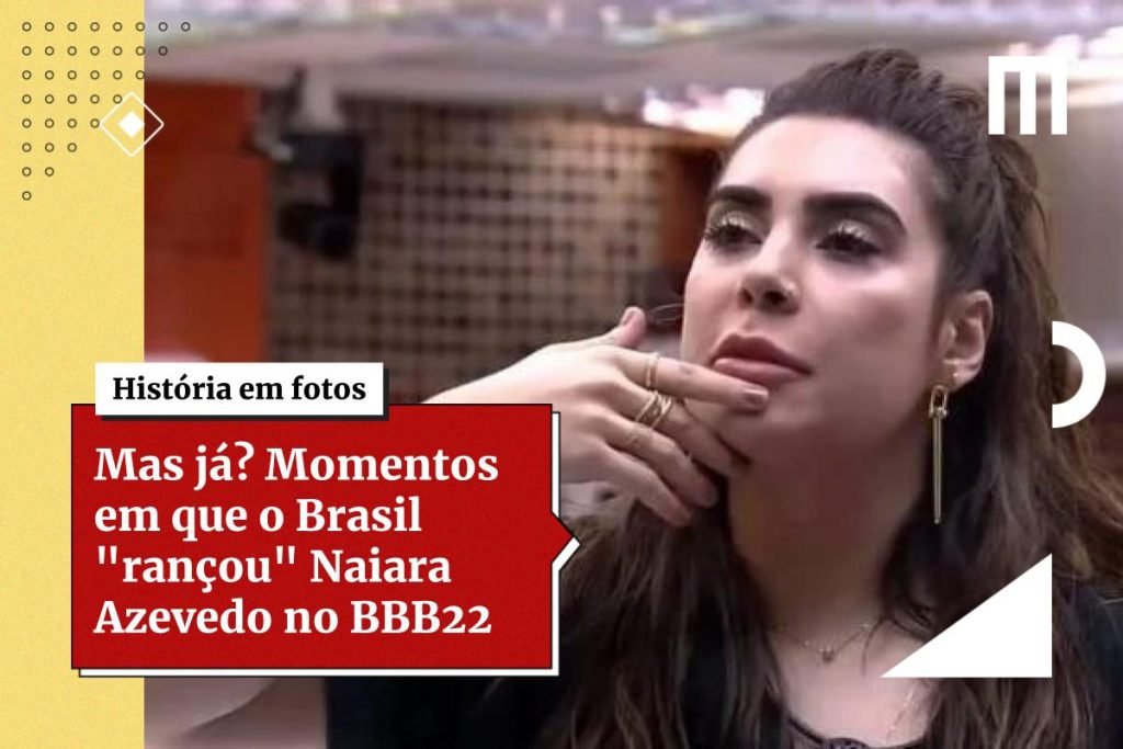 Na imagem colorida, uma mulher está posicionada no centro. Ela tem cabelos curtos e loiros, olhos castanhos e olha seriamente para a câmera