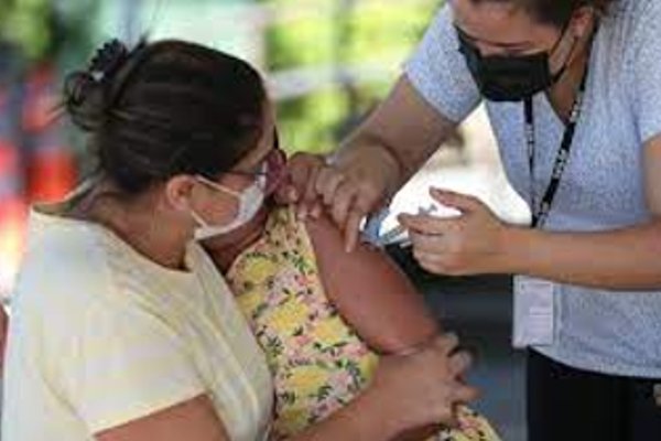 Colored photograph of a child getting vaccinated