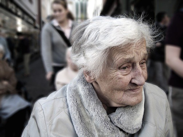Color photograph of an old woman