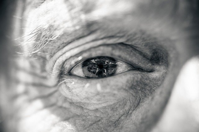 Black and white photograph of an elderly person's eye