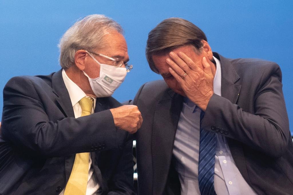 Ministro Paulo Guedes e Jair bolsonaro durante cerimônia da Caixa Econômica Federal “Democratizando o Acesso Ao Crédito”