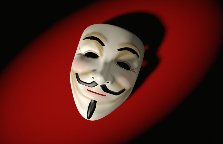 Máscara dos Anonymous faz sombra em fundo vermelho - Metrópoles