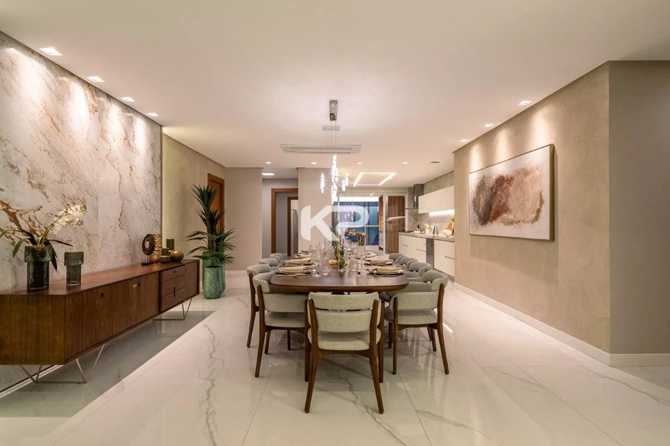 sala de jantar com lustre suspenso sobre a mesa