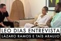 A imagem colorida mostra Leo Dias entrevistando Taís Araújo e Lázaro Ramos
