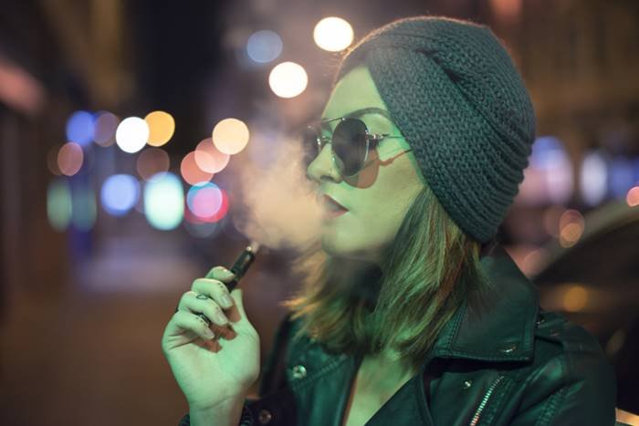 A person smoking an electronic cigarette - Metropolis