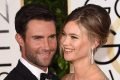 Foto colorida de Adam Lavine e Behati Prinsloo Levine-Metrópoles