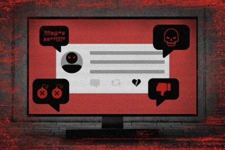 Foto colorida. Postagem em tela do computador com fundo vermelho espalha tags de ódio