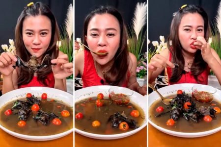 influencer tailandesa vestida de vermelho comendo sopa de morcego