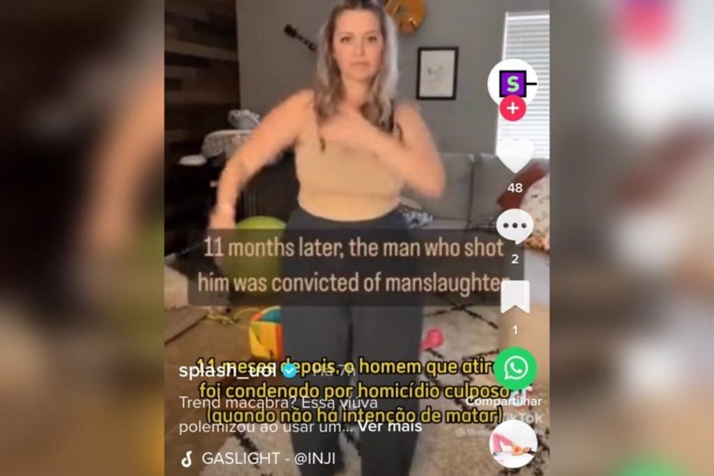 Foto colorida de mulher dançando em vídeo após porte do marido-Metrópoles