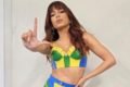 Cantora Anitta com roupa da cor da bandeiro do Brasil