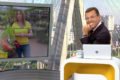 Rodrigo Bocardi sorri para a câmera enquanto Ananda Apple aparece no telão do Bom Dia SP - Metrópoles