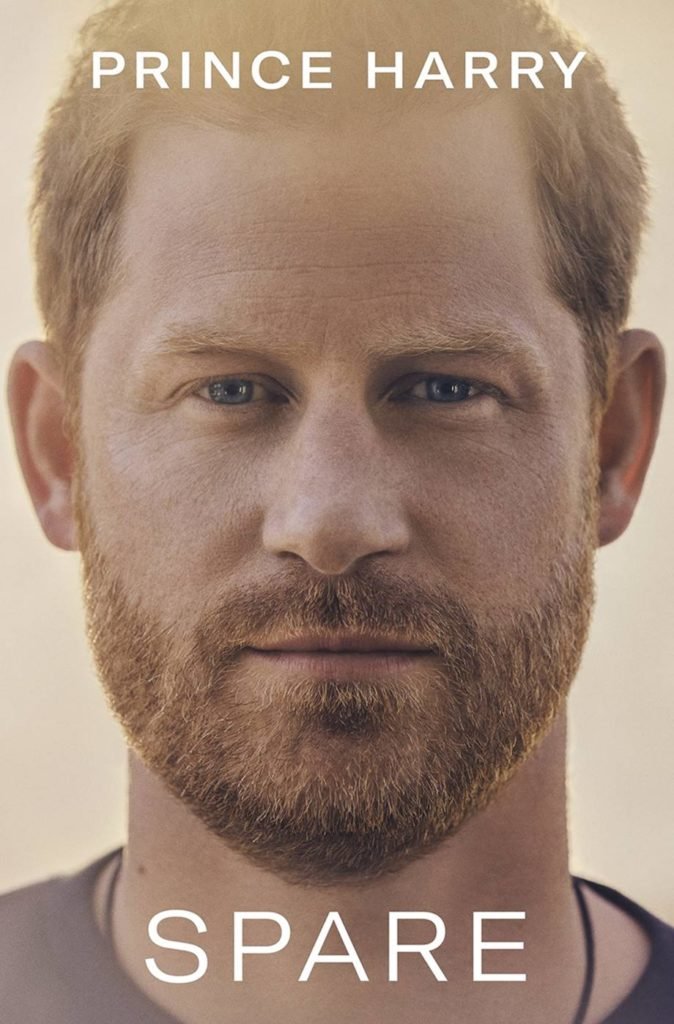 Cover of the book Spare, Prince Harry's autobiography.  The cover photo is a portrait of Harry's face, a young white man with blue eyes and red hair and beard.  - Metropolises