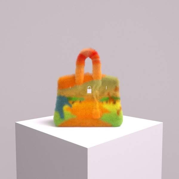 Bolsa de NFT colorida. Ela está apoiada sobre um cubo branco - Metrópoles