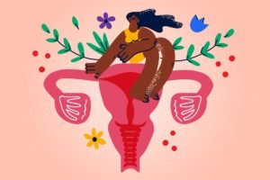 Ilustração colorida mostra mulher negra sentada em cima de um útero, com flores atrás - Metrópoles
