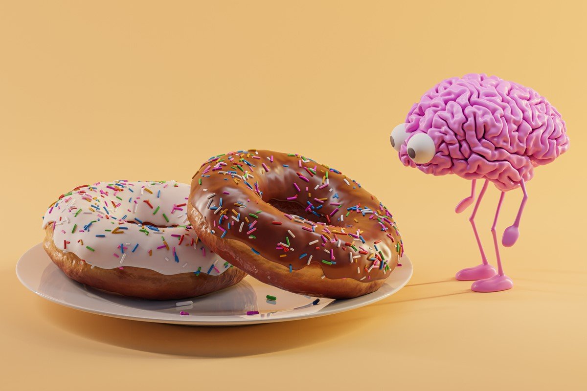 Foto colorida de dois donuts em um prato com um personagem de um cérebro olhando - Metrópoles