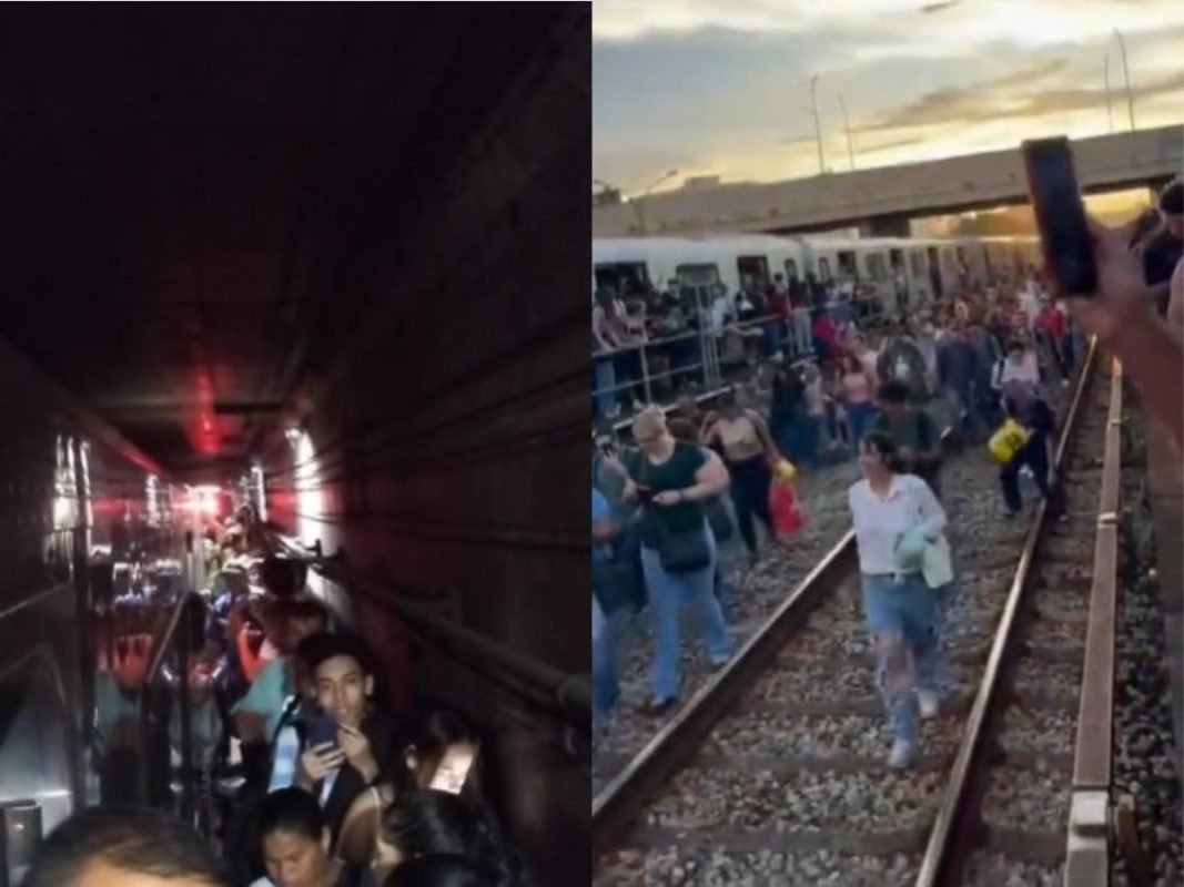 Imagem colorida mostra usuários da Linha 3-Vermelha do metrô de São Paulo andando pela linha do trem após a paralisação da circulação em algumas estações - Metrópoles